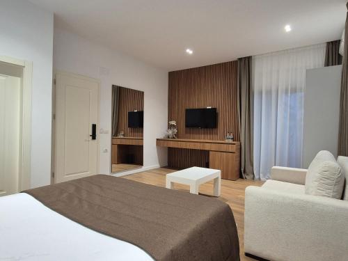 En eller flere senge i et værelse på ORCHIDS Hotel