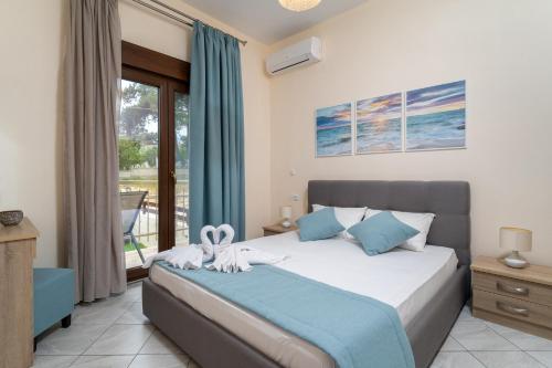 Postel nebo postele na pokoji v ubytování Maria Dina Apartments 1