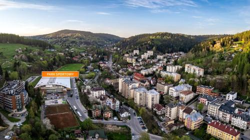an aerial view of a city with buildings at Park Sportowy, Sun & Snow in Krynica Zdrój