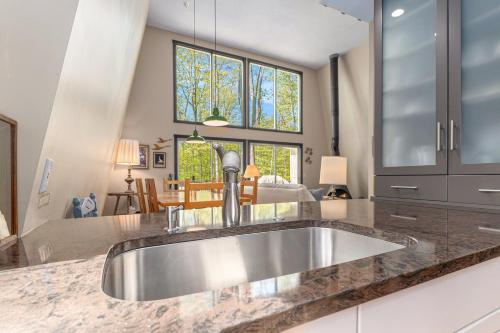 a kitchen with a stainless steel sink in a kitchen at Sugarloaf Chalet 3BDR Garden View at Cedar 2510 in Cedar