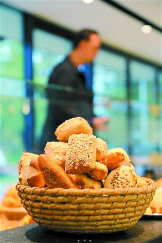 a basket of pastries sitting on a table at Business Motel Feldkirch in Feldkirch
