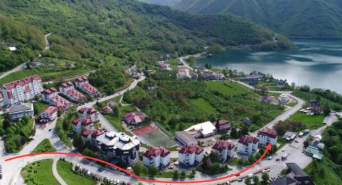 an aerial view of a resort on a hill with a lake at Lux Apartman Casablanca in Pluzine