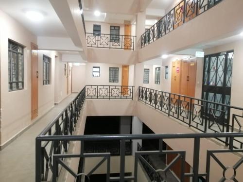 a hallway with stairs in a building at Alpha homes in Nakuru