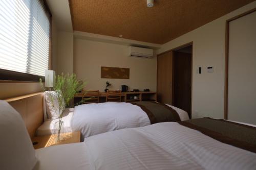 Xcellent Hotelにあるベッド