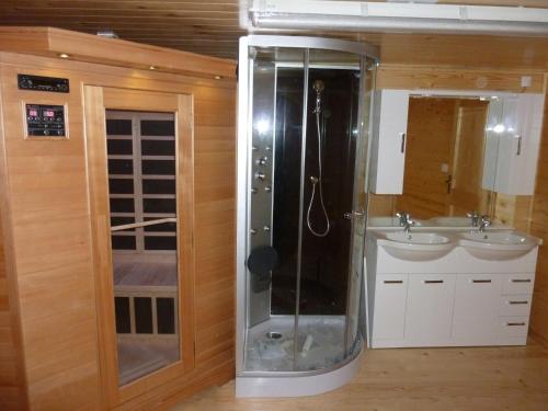 a bathroom with a shower and a sink at Chalet Bellevue in Les Orres