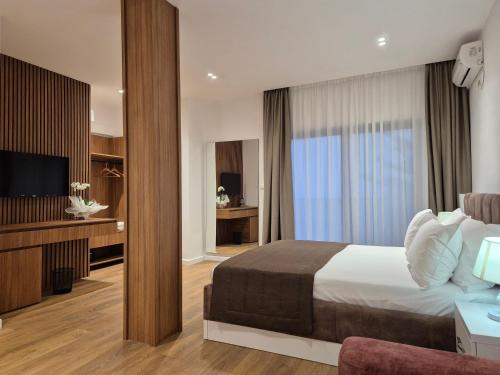 Postel nebo postele na pokoji v ubytování ORCHIDS Hotel