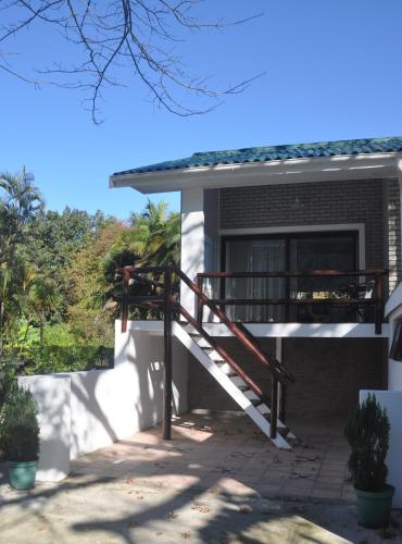 a house with a staircase in front of it at 62 on Adderley in George