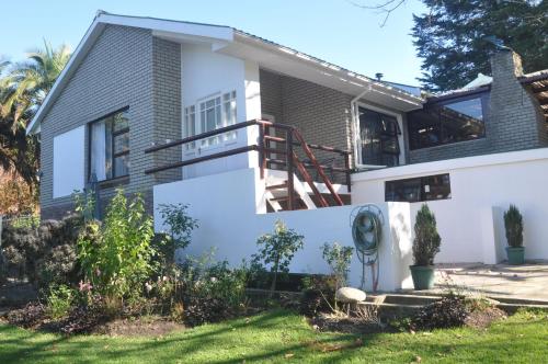 a house with a porch and a staircase at 62 on Adderley in George