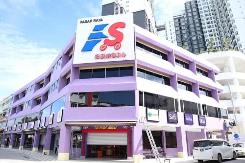 a purple and white building with a sign on it at Novo 8 Residences & Suites AQUA Pool by Nestcove in Melaka