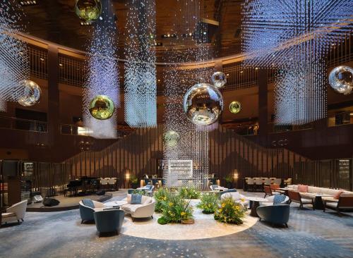 a large lobby with lights and furniture in a building at Grand InterContinental Seoul Parnas, an IHG Hotel in Seoul
