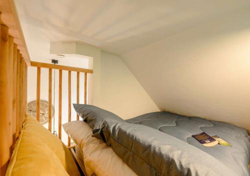 a bedroom with a bed in a room with a balcony at The Hideaway in Blaencelyn