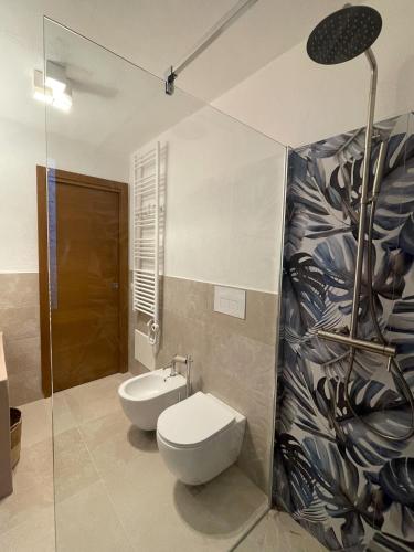 a bathroom with a toilet and a bidet at Tipica Villa Gallurese in Costa Smeralda in Cugnana