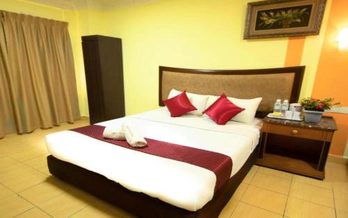 Cama o camas de una habitación en Sun Inns Hotel Batu Caves