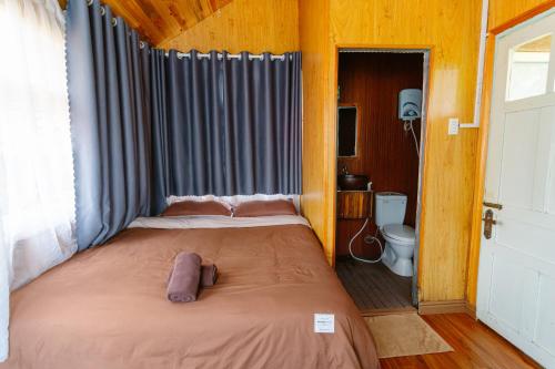 a bedroom with a large bed in a room at Hoàng Gia Trang in Da Lat