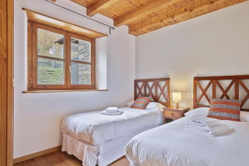 Posteľ alebo postele v izbe v ubytovaní Luderna - Apartamento con terraza Orri A3