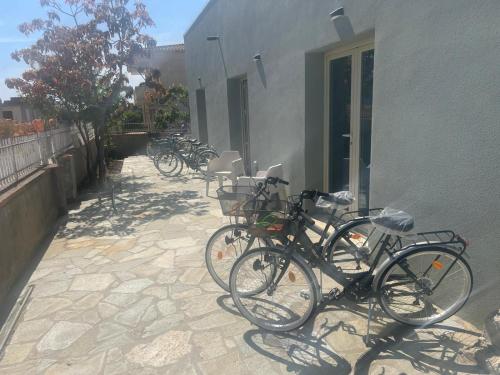 a group of bikes parked next to a building at Ajo' da Paolo in Budoni