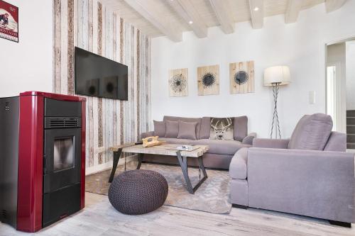 Luderna - Dúplex Sant Miquèuにあるテレビまたはエンターテインメントセンター