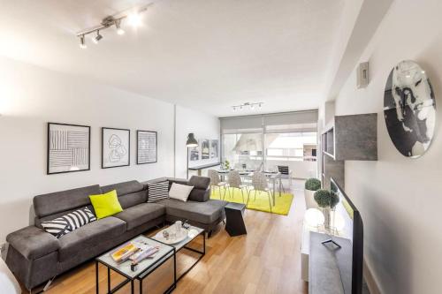 a living room with a couch and a table at Luxurious Bright & Stylish 2BR with Office in Nicosia in Nicosia