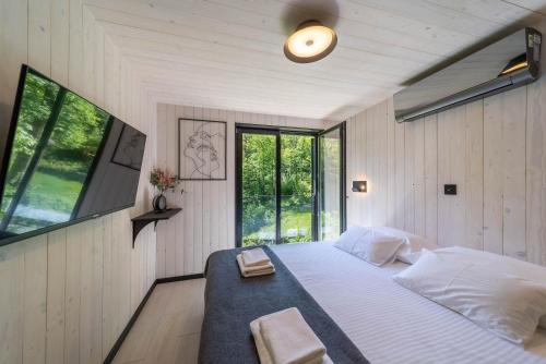 Ένα ή περισσότερα κρεβάτια σε δωμάτιο στο Mur mur cottage