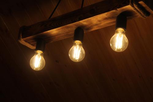 a group of light bulbs hanging from a ceiling at Vila D in Berat