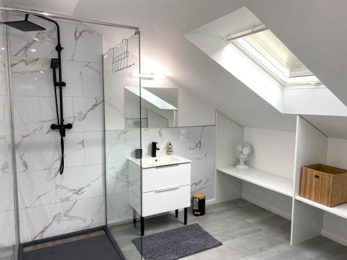 a bathroom with a shower and a sink at La Bulle / Jacuzzi, dome et terasse à la campagne in Moussey