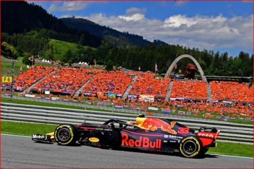 a racing car on a track in front of a crowd at Apartment Kapfenberg in Kapfenberg