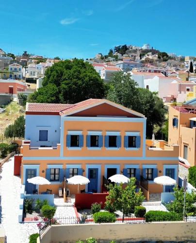 a house with a view of a city at Taxiarchis in Symi