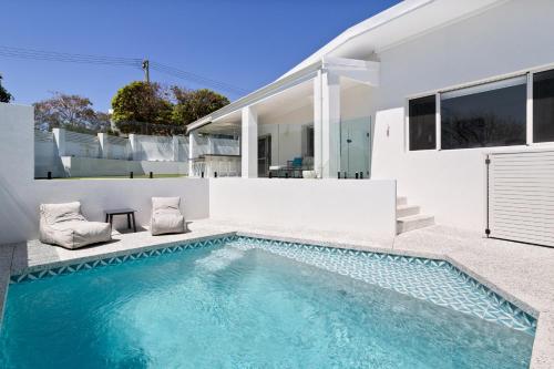 a swimming pool in the backyard of a house at Turquoise Waters Retreat in Perth
