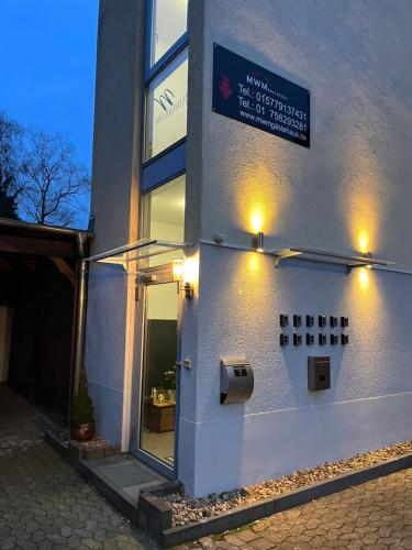 a building with a sign on the side of it at Doppelzimmer mit Bad- Fernseher in Meine