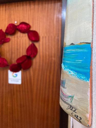 a door with a heart with flowers on it at VaNedda in Lentini