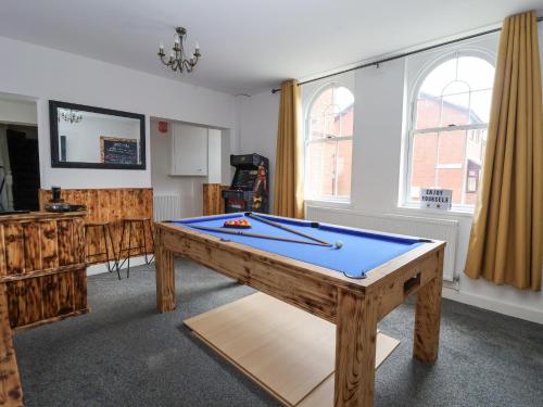 a living room with a pool table in it at The Old Station House in Withernsea