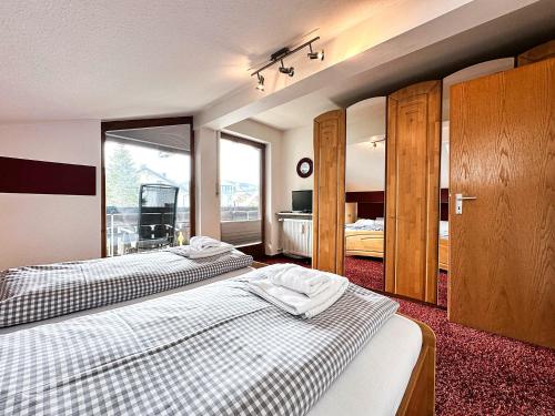 En eller flere senge i et værelse på FEWO Calendula