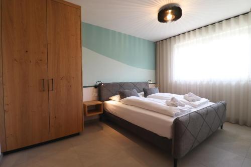 Postel nebo postele na pokoji v ubytování Residence Montani