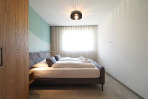 Postel nebo postele na pokoji v ubytování Residence Montani