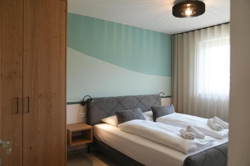Postel nebo postele na pokoji v ubytování Residence Montani