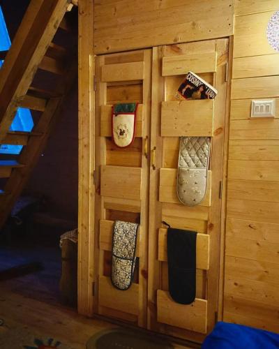 a room with a wooden cabinet with pillows at Alaknanda Kinare in Chamoli