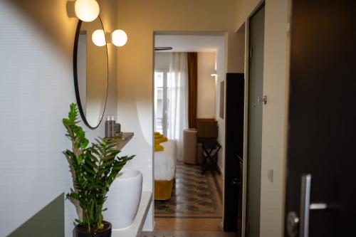 a bathroom with a toilet and a sink and a mirror at Bugan-Villa in Athens