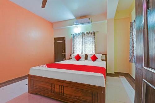 Ein Bett oder Betten in einem Zimmer der Unterkunft OYO Flagship Hotel New Star