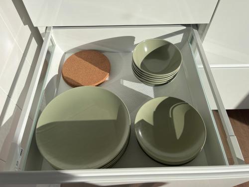 a glass cabinet with plates and bowls in it at Mesipesa Yellow Lodge in Meriküla