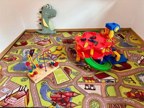 a childs toy train set on the floor at Ferienhof Wübbold - Lavendel in Rieste