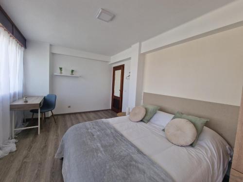 Ένα ή περισσότερα κρεβάτια σε δωμάτιο στο Praia Santa Baia