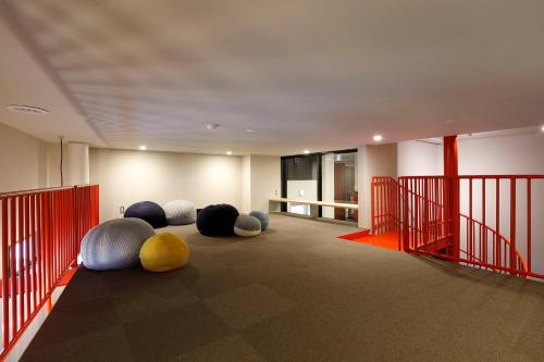 a room with a bunch of balls on the floor at HakoBA Hakodate by THE SHARE HOTELS in Hakodate