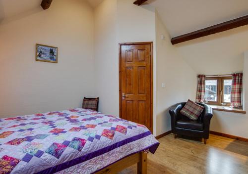 A bed or beds in a room at 2 Dolwen Farm Shop