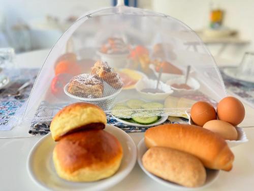 a tray of pastries and eggs on a table at Punta Sallustro Lipari in Lipari