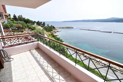 a balcony with a view of the water at Zennova #43, Pirgadikia Sky & Sea Home in Pyrgadikia