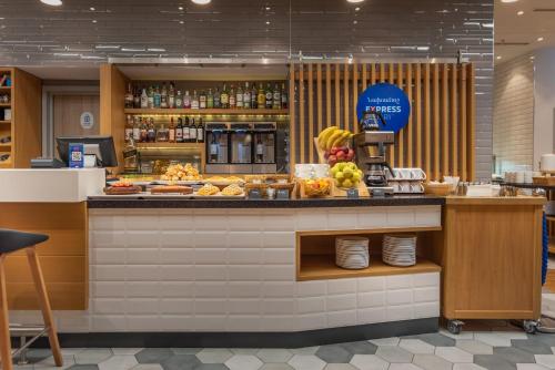 a bakery with a counter with food on it at Holiday Inn Express - Yerevan by IHG in Yerevan