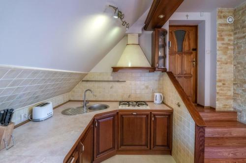 Kuchyň nebo kuchyňský kout v ubytování Pokoje Pod Tatrami & Apartament Biały Dunajec