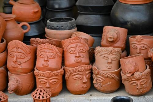 a group of clay pots sitting next to each other at Saj In The Forest, Pench in Seonī