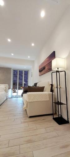a living room with a couch and a table at BARBARA Classy Apartments 103, Wellness in Siracusa
