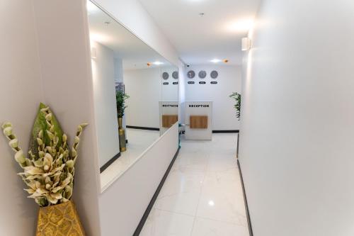 a corridor of an office building with a plant at Yusufhan Suites in Trabzon